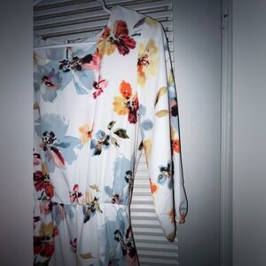 Floral dress with elbow length sleeves.